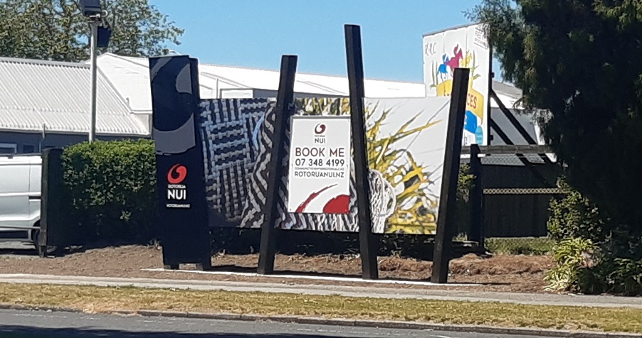 Signboard with events on side of the road